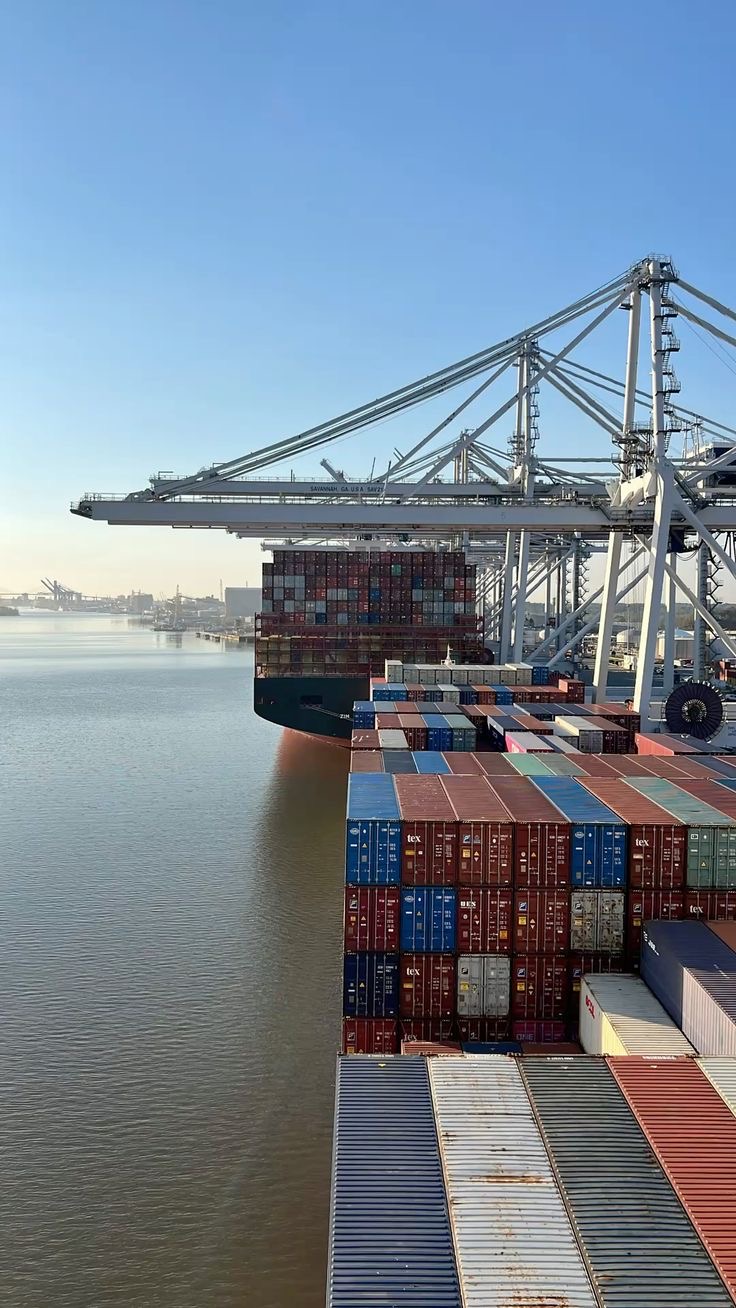 Stacked shipping containers on a vessel at a container terminal
